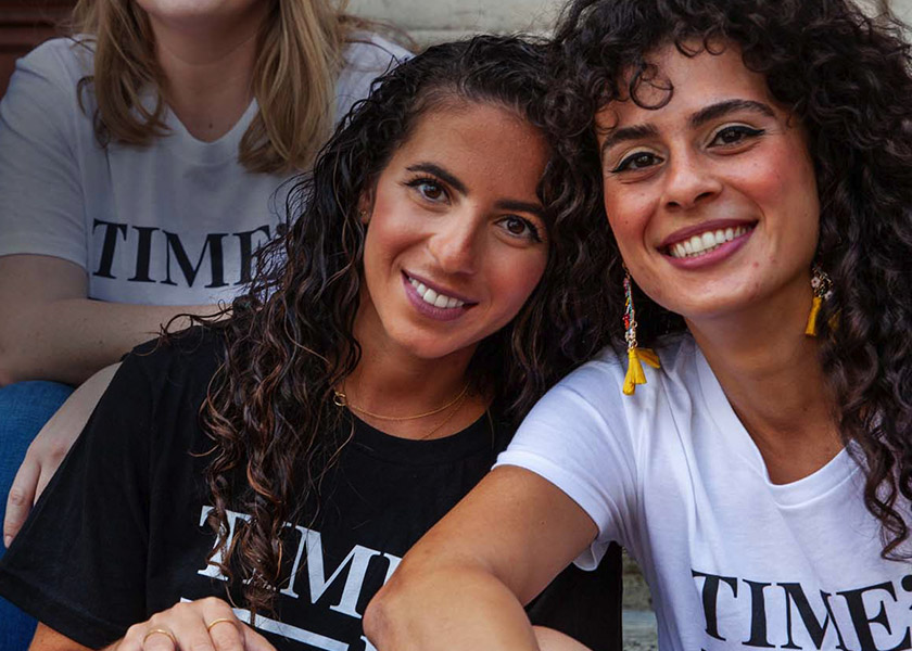 A group of diverse women wearing 'TIME'S UP t-shirts on the website design by Teal Media