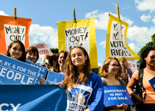 Image of young activists at a rally for driving money out of politics
