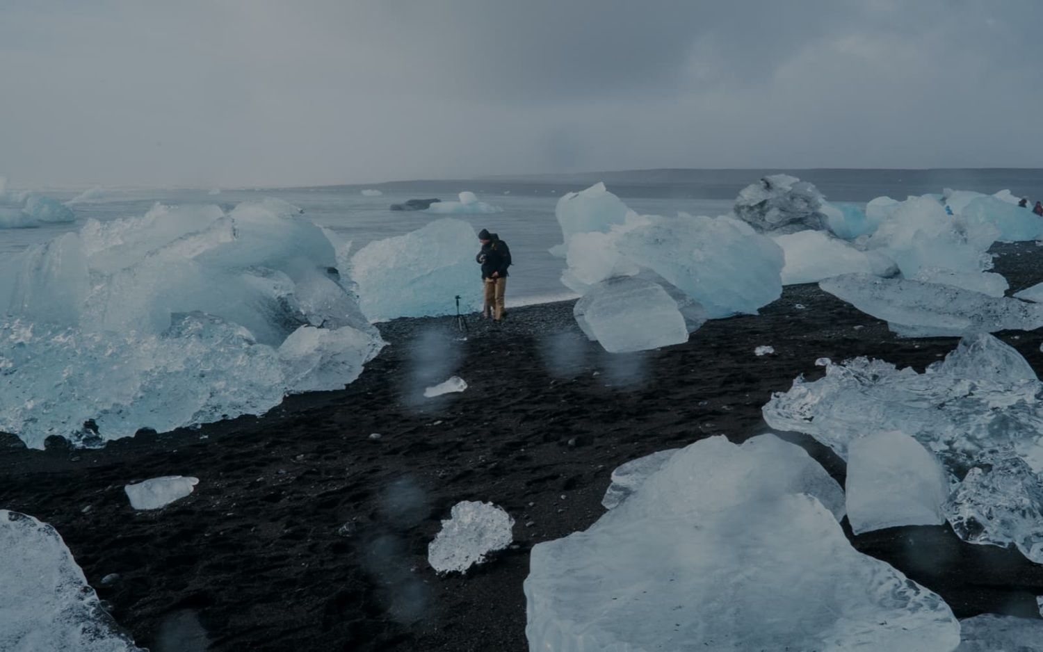 Man surveying the breaking ice sheets