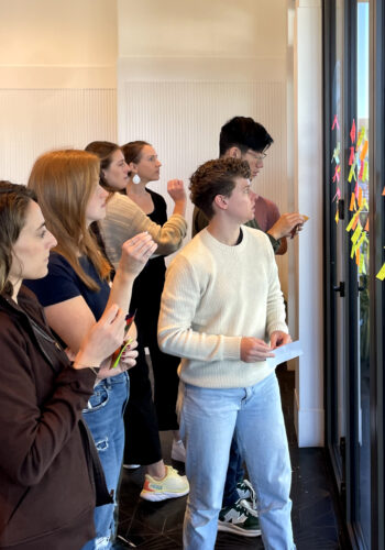 Design team members working on a post-it notes exercise