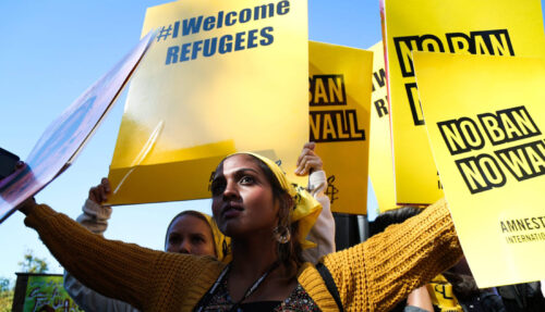 Amnesty supporters welcoming refugees