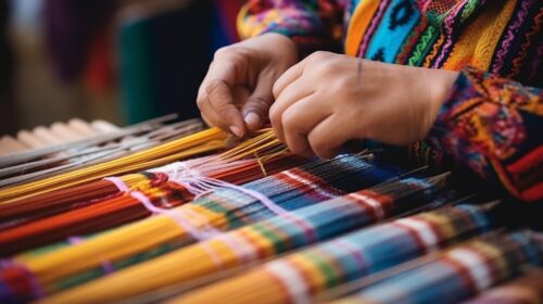 A close-up of hands expertly weaving a colorful ethnic folk rug