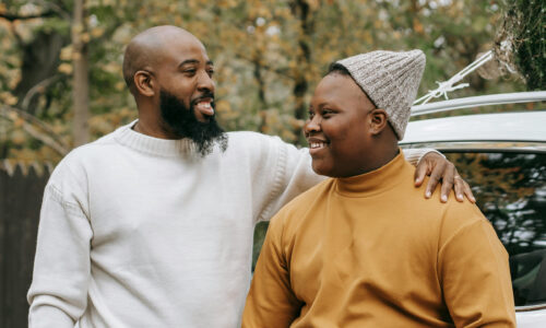 A father and son share a happy moment.