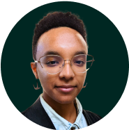 Closed-mouth smiling portrait of Schessa Garbutt, POC and nonbinary type designer