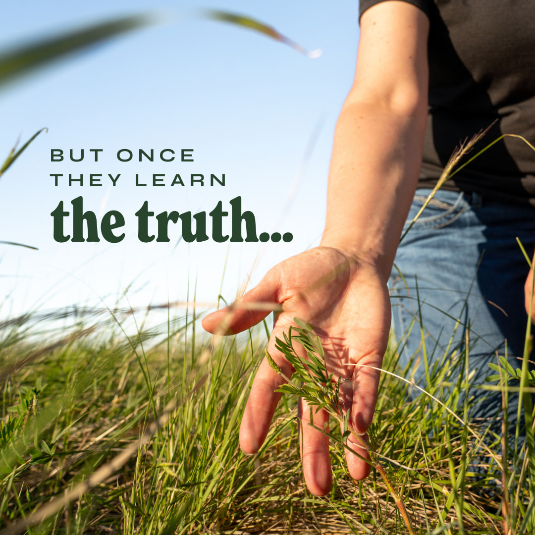 Hand reaching into the grass with text that reads: 