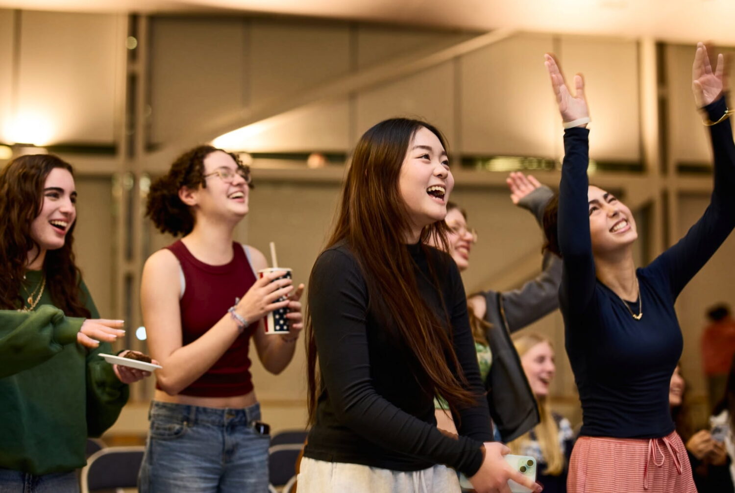 Recent image of Winsor girls clapping and cheering for their classmates